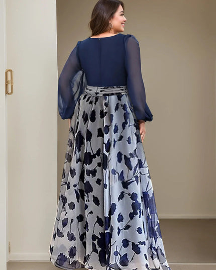 Back view of navy floral maxi dress showing long sleeves and full skirt