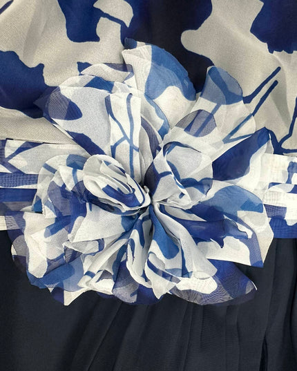 Detailed view of navy and white floral print fabric with dimensional texture