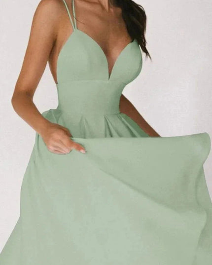 Front view of mint green wedding guest midi dress with deep V neck and full skirt
