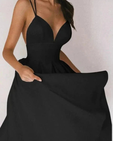 Black V neck open back midi dress with thin straps and full skirt for wedding guest