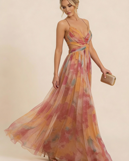Side view of watercolor floral maxi dress with flowing pleated skirt and wrap top