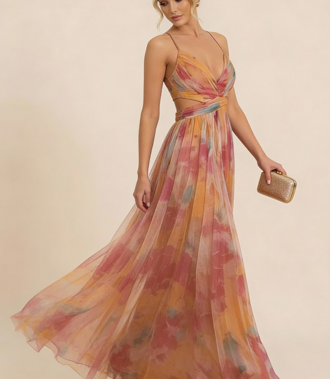 Side view of watercolor floral maxi dress with flowing pleated skirt and wrap top