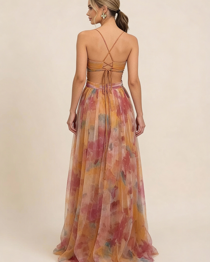 Back view of watercolor floral maxi dress showing lace-up strappy back detail