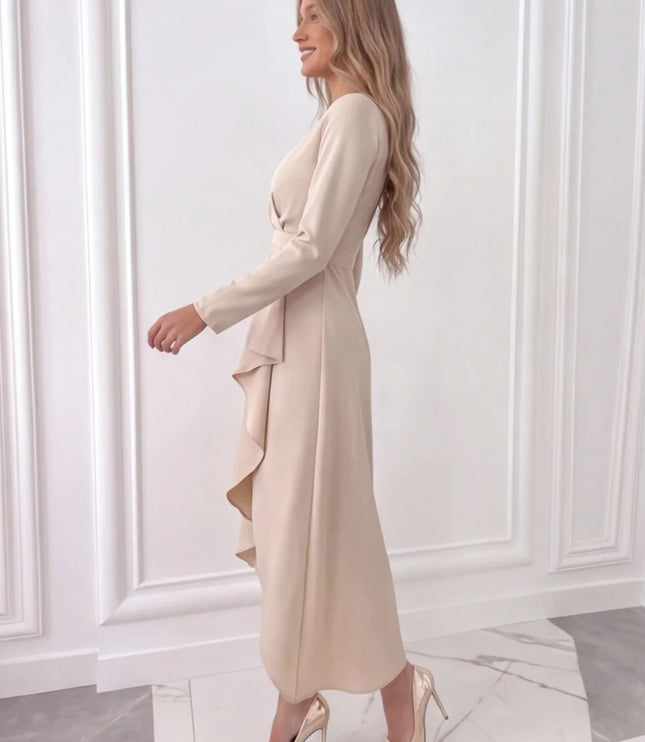Side view of beige women's wedding guest wrap midi dress with flowing skirt and long sleeves