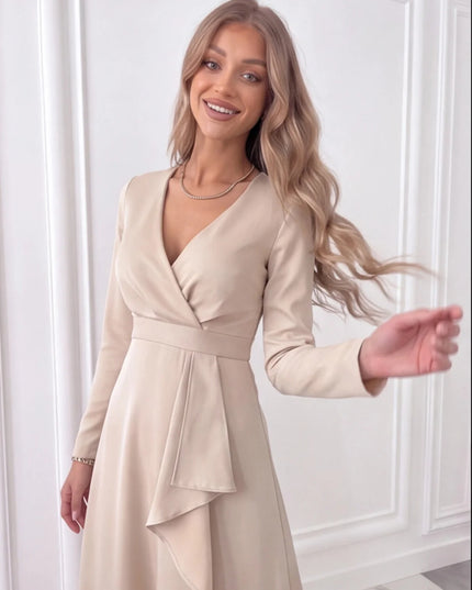 Close-up of beige wrap midi dress showing V-neck bodice, waist tie detail and draped front