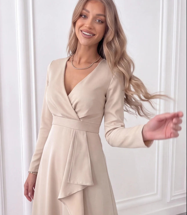 Close-up of beige wrap midi dress showing V-neck bodice, waist tie detail and draped front