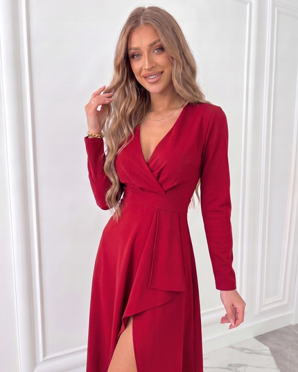 Close-up of red women's wrap midi dress showing fitted waist, long sleeves and soft draped neckline