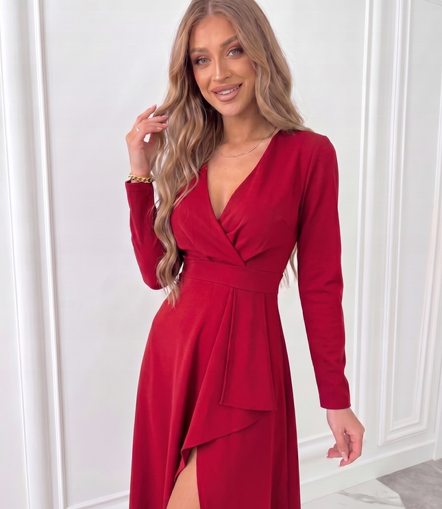 Close-up of red women's wrap midi dress showing fitted waist, long sleeves and soft draped neckline