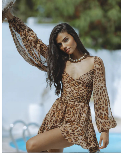 Tan leopard print wrap mini dress with long sleeves and flowing skirt